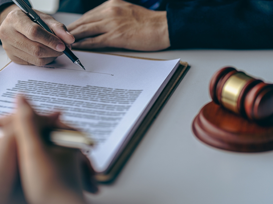 Investor reviewing financial losses with legal counsel